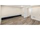 Spacious basement with wood-look flooring and neutral walls, offering versatile living space at 1890 Carla Dr, Morrow, GA 30260