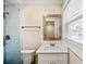 The renovated bathroom with stylish glass-enclosed shower and modern vanity provides a spa-like feel at 1890 Carla Dr, Morrow, GA 30260