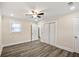 A sunny bedroom boasts modern floors, fresh paint, and recessed lights, inviting comfort at 1890 Carla Dr, Morrow, GA 30260