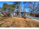 Inviting exterior view of a freshly renovated home with new driveway and landscaping at 1890 Carla Dr, Morrow, GA 30260