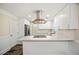 Newly renovated kitchen with white cabinets, quartz countertops, and stainless steel appliances at 1890 Carla Dr, Morrow, GA 30260