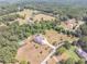 Stunning aerial view of a beautiful home surrounded by mature trees, set on a large and secluded lot at 2740 Bountiful Pl, Lawrenceville, GA 30045