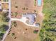 Aerial view of a large brick house on a sprawling lot with a tennis court and mature trees at 2740 Bountiful Pl, Lawrenceville, GA 30045