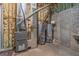 Unfinished basement showcasing the home's essential systems, including furnace and water heaters at 2740 Bountiful Pl, Lawrenceville, GA 30045