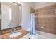 Bathroom features a granite countertop, large mirror, and a tiled shower and bath combo at 2740 Bountiful Pl, Lawrenceville, GA 30045
