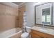 Bathroom featuring a jacuzzi tub and a granite countertop sink for a luxurious experience at 2740 Bountiful Pl, Lawrenceville, GA 30045
