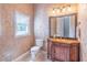 Bathroom featuring decorative walls, vanity with a vessel sink, and natural light at 2740 Bountiful Pl, Lawrenceville, GA 30045