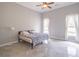 Bright bedroom with neutral walls, tile flooring, and two windows for natural light at 2740 Bountiful Pl, Lawrenceville, GA 30045