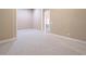Serene bedroom with soft carpet and doorway to another room for easy access at 2740 Bountiful Pl, Lawrenceville, GA 30045