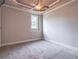 Bedroom featuring neutral-toned walls, a ceiling fan, and plush carpeting at 2740 Bountiful Pl, Lawrenceville, GA 30045