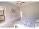 Spacious bedroom with tile floors, a ceiling fan, and a large walk in closet at 2740 Bountiful Pl, Lawrenceville, GA 30045