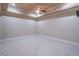 Bonus room featuring neutral-toned walls, a ceiling fan, and cozy carpeting at 2740 Bountiful Pl, Lawrenceville, GA 30045
