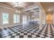 Game room featuring checkerboard flooring, elegant chandeliers, and plenty of space at 2740 Bountiful Pl, Lawrenceville, GA 30045