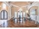 Spacious home gym featuring hardwood floors, coffered ceilings, and ample natural light at 2740 Bountiful Pl, Lawrenceville, GA 30045