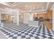 Open-concept kitchen with stainless steel appliances and checkered flooring, perfect for entertaining at 2740 Bountiful Pl, Lawrenceville, GA 30045