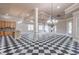 Open living space with checkerboard floors and a kitchen and living room combo at 2740 Bountiful Pl, Lawrenceville, GA 30045