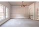 Large main bedroom with a ceiling fan and an attached bathroom suite, offering comfort and privacy at 2740 Bountiful Pl, Lawrenceville, GA 30045