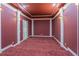 Spacious media room with layered carpeting and decorative moldings for the perfect cinematic experience at 2740 Bountiful Pl, Lawrenceville, GA 30045