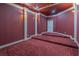 Home theater boasts tiered seating and elegant wall sconces for immersive entertainment at 2740 Bountiful Pl, Lawrenceville, GA 30045