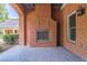 Outdoor fireplace with brick exterior and polished floors, perfect for relaxing outdoor gathering space at 2740 Bountiful Pl, Lawrenceville, GA 30045