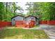 A wooden deck and a lush, green yard, offering privacy and space for outdoor enjoyment at 3479 Thompson Dr, Atlanta, GA 30331