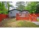 A wooden deck and a lush, green yard, offering privacy and space for outdoor enjoyment at 3479 Thompson Dr, Atlanta, GA 30331