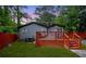A wooden deck and a lush, green yard, offering privacy and space for outdoor enjoyment at 3479 Thompson Dr, Atlanta, GA 30331