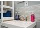 Bathroom featuring vanity, brushed nickel faucet, and backsplash at 3479 Thompson Dr, Atlanta, GA 30331