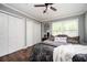 Bedroom featuring neutral walls, a ceiling fan, and a closet offering ample storage space at 3479 Thompson Dr, Atlanta, GA 30331