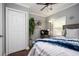 Comfortable bedroom with a ceiling fan, hardwood floors, closet and ample natural light at 3479 Thompson Dr, Atlanta, GA 30331