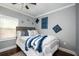 Stylized bedroom featuring decor, a ceiling fan, hardwood floors, and natural light at 3479 Thompson Dr, Atlanta, GA 30331