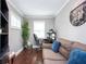 Functional office space with a comfortable sofa, hardwood floors, and natural light for productivity at 3479 Thompson Dr, Atlanta, GA 30331