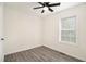 A bedroom featuring gray wood-look flooring, a ceiling fan and a window at 523 Mount Zion, Hapeville, GA 30354