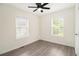 Bright bedroom features grey wood-look flooring, ceiling fan and lots of natural light at 523 Mount Zion, Hapeville, GA 30354