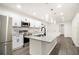 Modern kitchen featuring granite countertops, stainless appliances, and large kitchen island at 523 Mount Zion, Hapeville, GA 30354