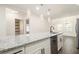 Bright kitchen with granite counters, stainless appliances, and modern lighting at 523 Mount Zion, Hapeville, GA 30354