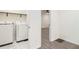 Laundry room with white washer and dryer, and white tiled flooring at 523 Mount Zion, Hapeville, GA 30354