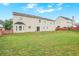 The large backyard offers opportunities for outdoor entertaining and recreation at 841 Holly Meadow Dr, Buford, GA 30518