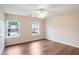 Bright bedroom with hardwood floors and a large window for plenty of natural light at 841 Holly Meadow Dr, Buford, GA 30518