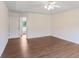 Large bedroom featuring a ceiling fan, hardwood floors, and abundant natural light at 841 Holly Meadow Dr, Buford, GA 30518