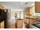 Charming kitchen with granite countertops, stainless steel appliances, and a large island for dining at 841 Holly Meadow Dr, Buford, GA 30518