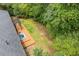 Aerial view of wooden deck with pergola next to tree-lined lawn at 3614 N Druid Hills N Rd, Decatur, GA 30033