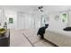 A modern bedroom featuring a ceiling fan, an exterior door, and bright natural light at 3614 N Druid Hills N Rd, Decatur, GA 30033