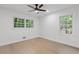 Bright bedroom featuring wood floors, a large window, and a ceiling fan at 3614 N Druid Hills N Rd, Decatur, GA 30033