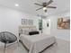 Bright bedroom featuring a ceiling fan and neutral-toned furnishings at 3614 N Druid Hills N Rd, Decatur, GA 30033