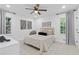 Well-lit bedroom with bright windows and a ceiling fan at 3614 N Druid Hills N Rd, Decatur, GA 30033