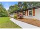 A freshly painted home with neat landscaping along a walkway leading to the front door at 3614 N Druid Hills N Rd, Decatur, GA 30033