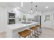 Open kitchen featuring stainless steel appliances, a large island, and pendant lighting at 3614 N Druid Hills N Rd, Decatur, GA 30033
