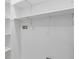 Bright laundry area features storage shelves, white walls and tile flooring at 3614 N Druid Hills N Rd, Decatur, GA 30033