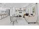 Open-concept living space showcases a modern fireplace, sleek furniture, and seamless flow to the kitchen at 3614 N Druid Hills N Rd, Decatur, GA 30033